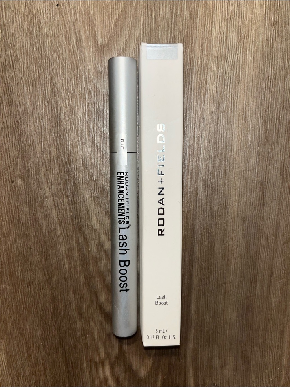 Rodan + Fields Lash Boost in Silver and Cream Packaging